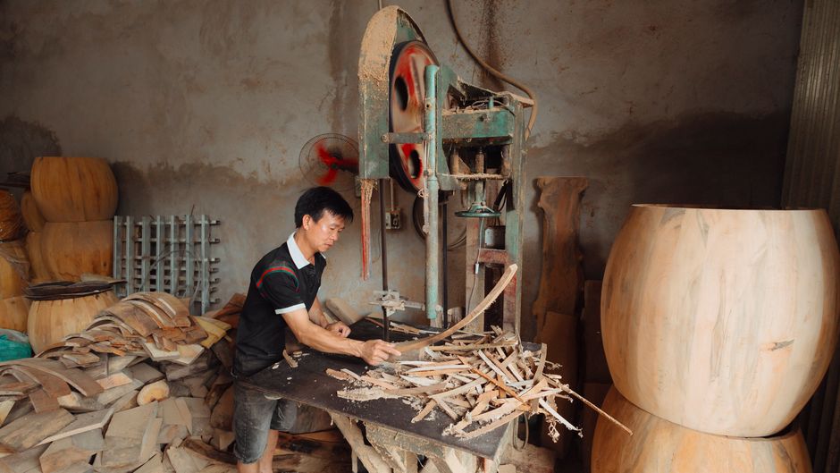 Carpenter crafting custom furniture in a workshop